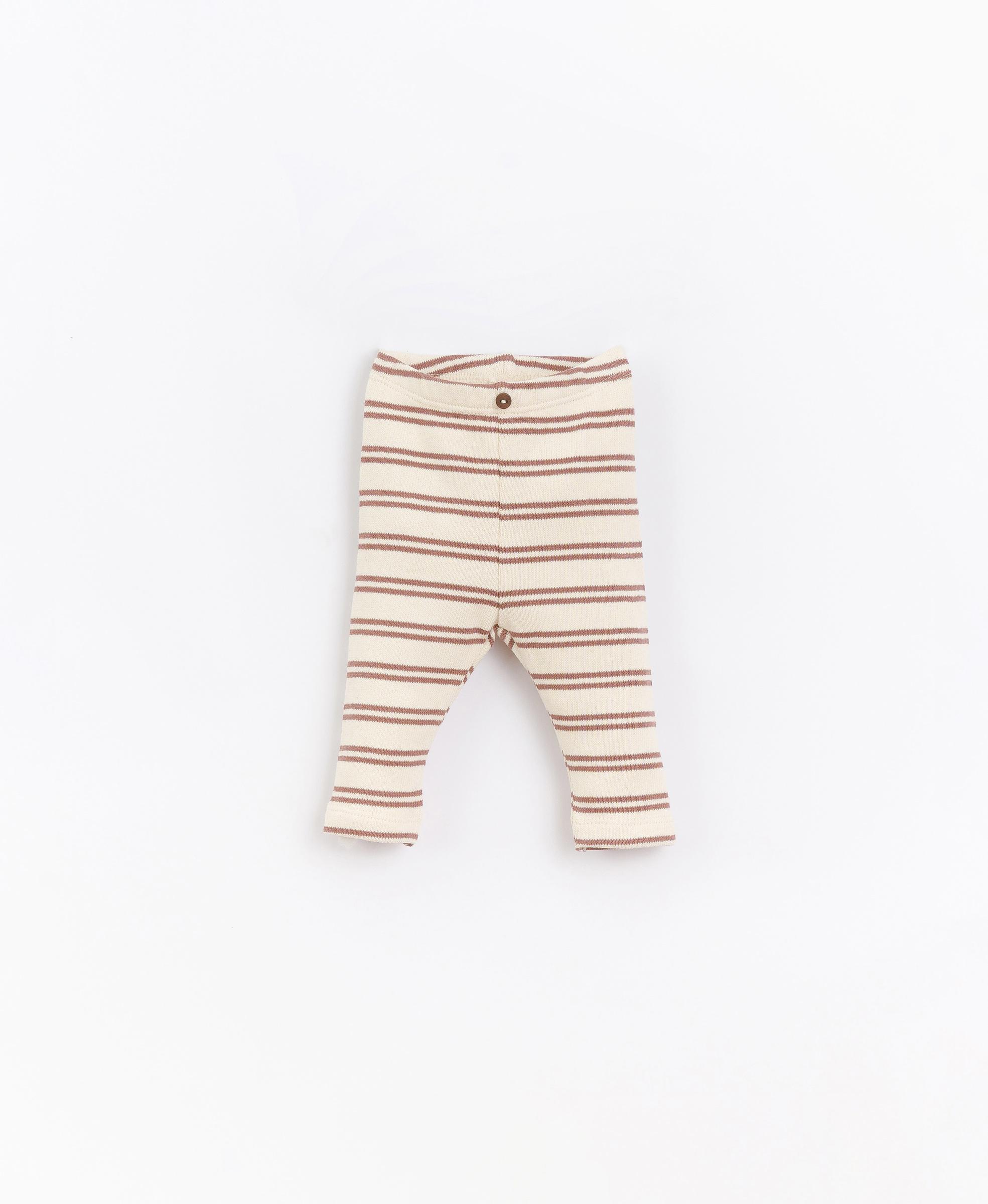 Striped leggings with decorative button